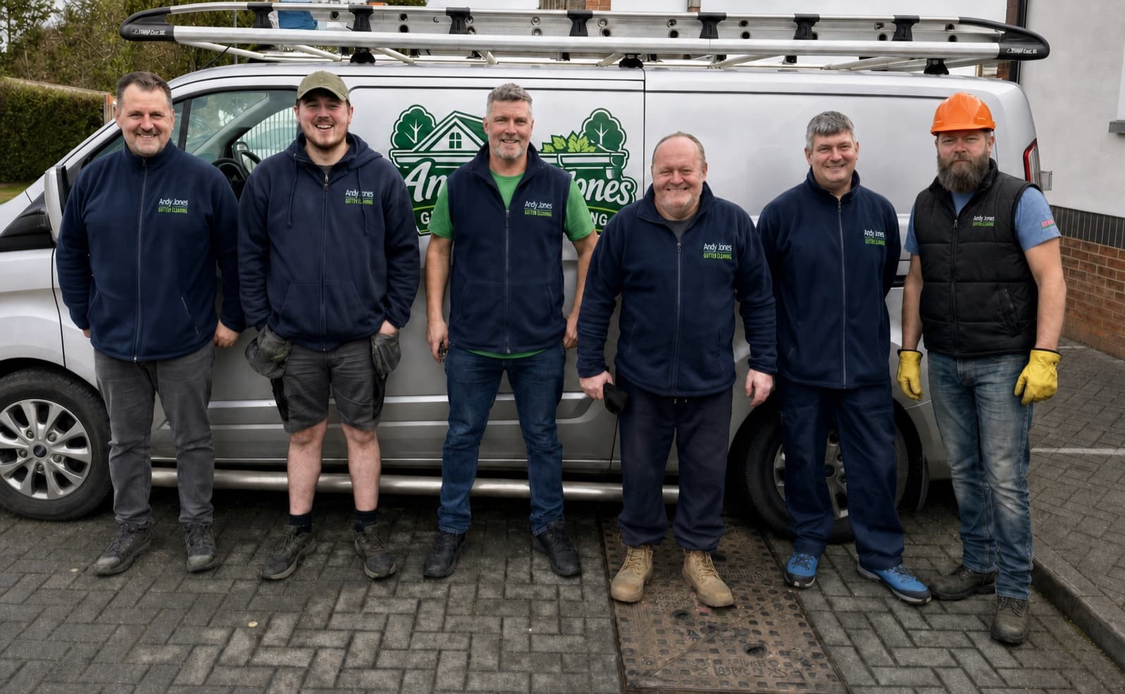 Andy Jones local exterior cleaning team standing beside a branded van